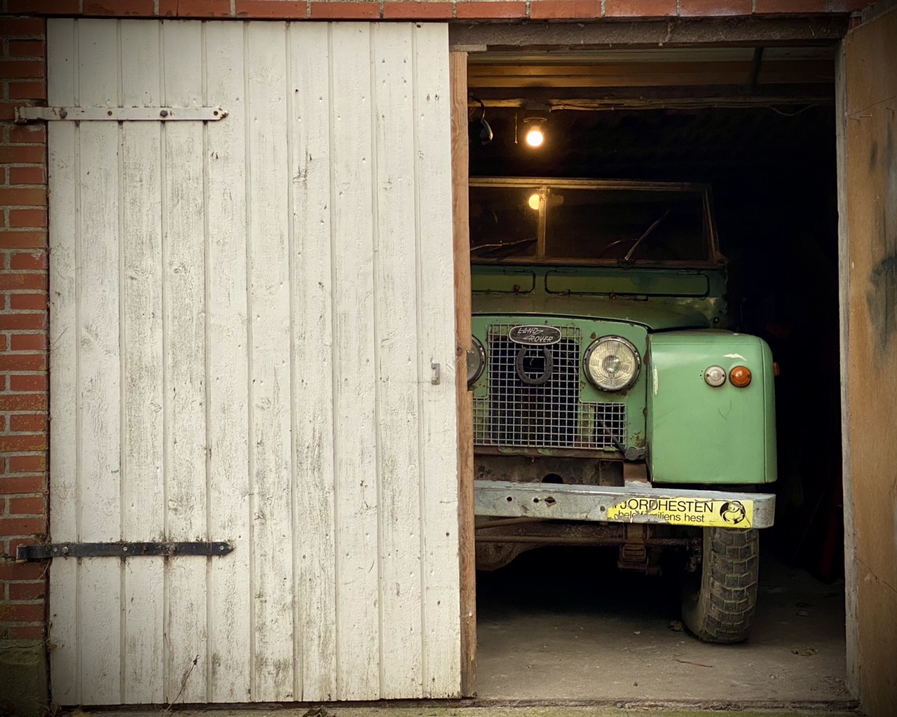 Laura peeping out of her new garage